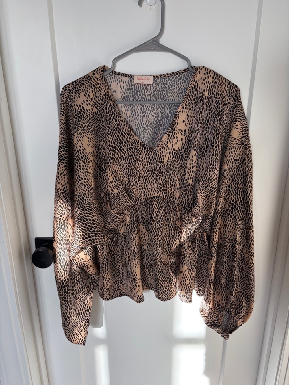 Beige & Black Printed V-Neck Peplum Blouse